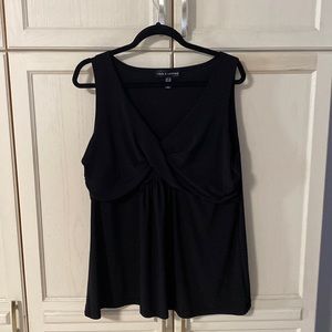 A black top that is sleeveless and a size 2X